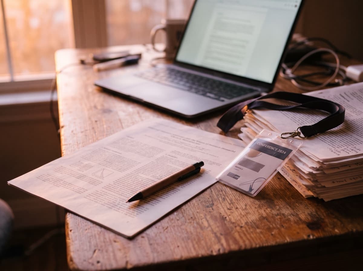 A printed research paper and a pen on a desk